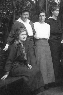 Katherine Delmar Burke (second from left) with her teachers at the school's original location on Broderick Street.