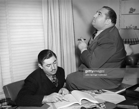 Composer Harry Revel reads a script while his partner Mack Gordon... News  Photo - Getty Images